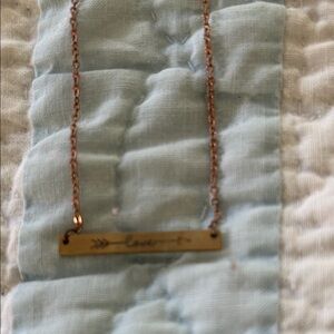 Gold Bar Necklace with Engraved love and arrow. 18 in long with lobster clasp.